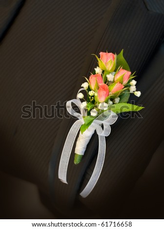 Pink roses Wedding Boutonniere On Suit of Groom
