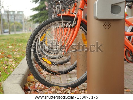 Row of bicycle tires on bicycle rental station