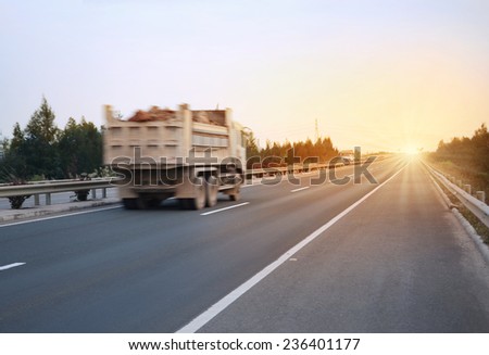 Dump truck at sunset