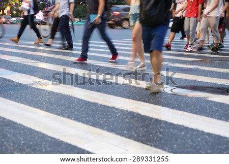 Pedestrians crowd in city street abstract blur