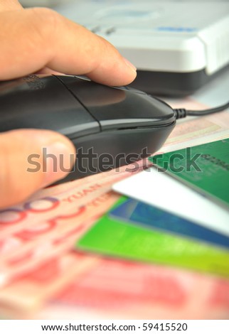 Hand use computer Mouse on money