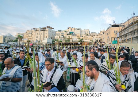 JERUSALEM - OCTOBER 14, 2014: Religious Jews sunrise prayer service at the Western Wall, Kotel, Israel