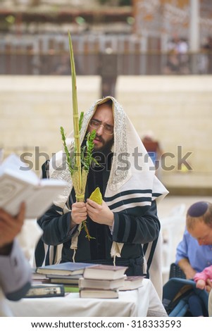 JERUSALEM - OCTOBER 14, 2014: Religious Jews sunrise prayer service at the Western Wall, Israel