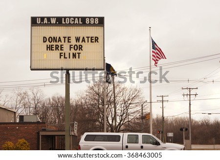 YPSILANTI, MI/USA Jan. 27, 2016: Sign at UAW local asking for donations for the Flint water crisis. The water in Flint has high levels of lead causing a health crisis.