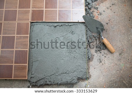 Home improvement, renovation construction trowel with cement mortar for tiles work, tile floor adhesive