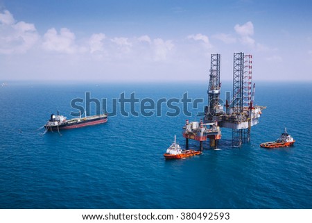 Image of oil platform while cloudless day,color tone