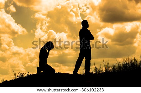Silhouette of a crying woman and man angry