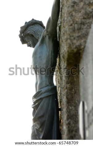 A Jesus figure at the cross. The cross is made of stone