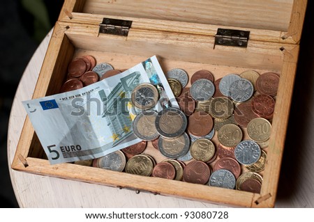 wooden cash desk with money
