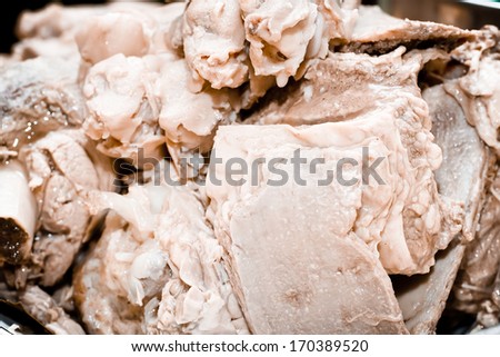 Preparation cold jelly meat based dish of pork feet, beef and turkey.