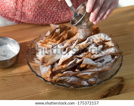 Preparing traditional Polish crunch cakes called Faworki or Chrust.
