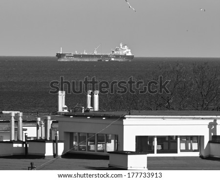 GDANSK BRZEZNO, POLAND - FEBRUARY 17, 2014: Beautiful view from the window of the Gulf of Gdansk. In the background, vessels in Reda port of Gdansk.