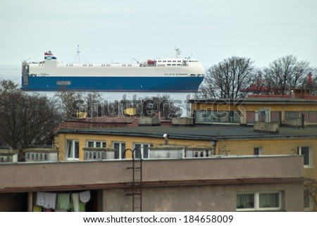 GDANSK BRZEZNO, POLAND - MARCH 22, 2014: Beautiful view from the window of the Gulf of Gdansk. On the photo, vessel City OF ST. PETERSBURG calling at a port of Gdansk.