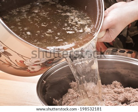 In Polish cuisine, on the Polish table. Preparation of Liver pate. On the picture mixing pig liver pate.