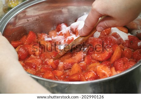 In the Polish kitchen. Preparing a delicious strawberry jam.