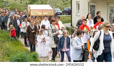 GDANSK KOWALE, POLAND - JUNE 07, 2012: Religious procession at Corpus Christi Day in one of the suburban districts of Gdansk. June 07, 2012. Gdansk, Kowale, Poland.