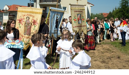 GDANSK KOWALE, POLAND - MAY 30, 2013: Religious procession at Corpus Christi Day in one of the suburban districts of Gdansk. May 30, 2013. Gdansk, Kowale, Poland.