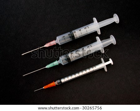 Hypodermic syringe and needle used for immunization.