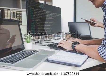 Programmers cooperating at Developing programming and website working in a software develop company office, writing codes and typing data code.
