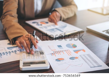 Business Financing Accounting Banking Concept, businesswoman doing finances and calculate about cost to real estate investment and in other, tax system.