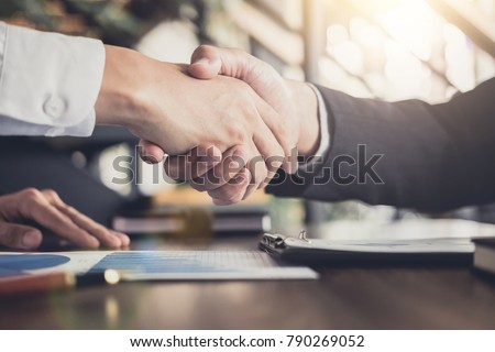 Meeting and greeting concept, Two confident Business handshake and business people after discussing good deal of Trading contract and new projects for both companies, success, partnership, co worker.