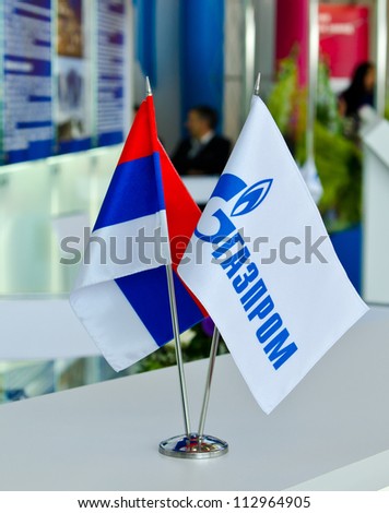 ULAN-UDE, RUSSIA - SEPTEMBER 15: Flags of Russia and of Gazprom at exhibition stand of Baltic Economic Forum, September 15, 2012 in Ulan-Ude, Buryatia, Russia. Gazprom - the main sponsor of this forum