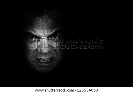 Black-and-white portrait of an angry man