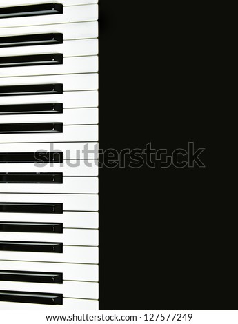 Piano keyboard on a black reflective background. Plenty of space to add your graphics or text