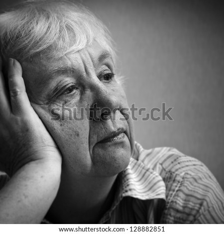 Old sad woman. Black and white portrait