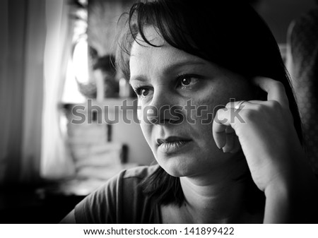 Sad woman. Black and white portrait. Real people series.