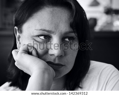 Sad pensive woman. Black and white portrait