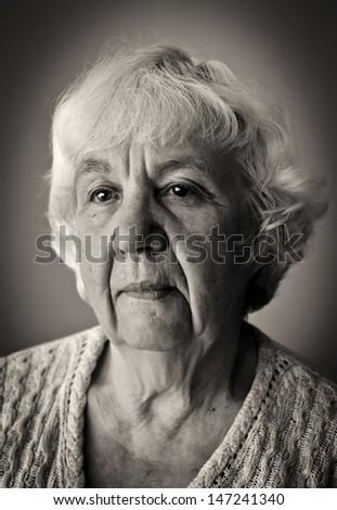 Black and white portrait of a lonely old woman