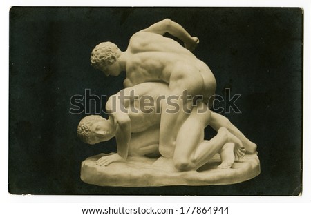 MOSCOW, RUSSIA - CIRCA 1900s: An antique photo shows an ancient statue athletes wrestlers