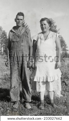 CANADA - CIRCA 1920s: An antique photo shows  portrait of a farmer and his wife
