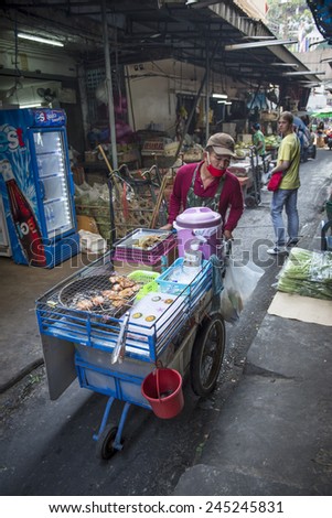 BANGKOK, THAILAND - DECEMBER 25, 2014: Street Photography of Street market in China town. Roll grill for cooking traditional Thai food.