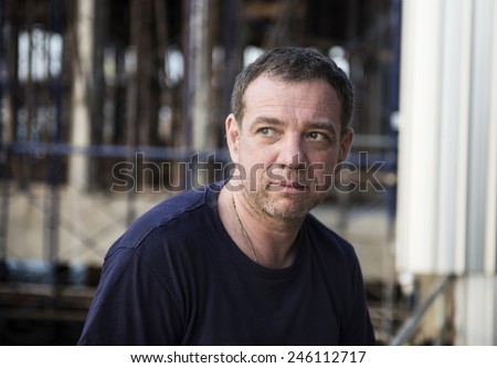 Street photography of smiling 40-year-old man