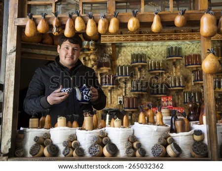BUKHARA, UZBEKISTAN - MARCH 16, 2015: Tea shop. A man sells tea and herbs.