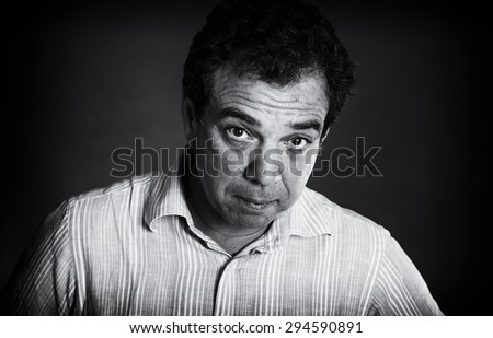 Black and white portrait of a pensive man