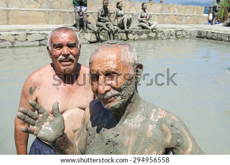 SULTANIYE, TURKEY - JULY 05, 2015: People are taking a mud bath.