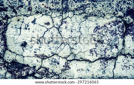 Cracked concrete texture closeup background. Toned