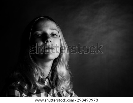 High contrast black and white portrait of a teen girl