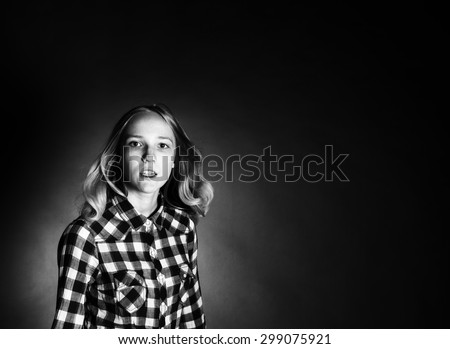 High contrast black and white portrait of a teen girl