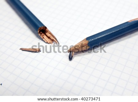 Broken pencil on a pad