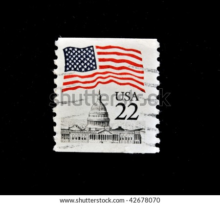 USA - CIRCA 1986: A stamp printed in USA shows state symbols of the U.S. flag and the White House, circa 1986. \