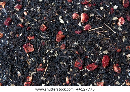 Big leaf black fruit tea as background