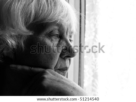 Black and white portrait of an elderly woman. Close-up.