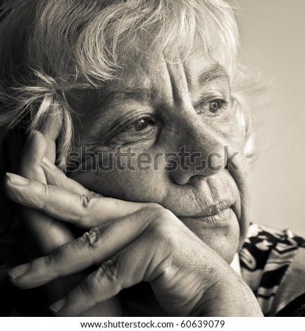Black and white portrait of a pensive elderly woman
