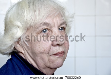 Old silver-haired woman.