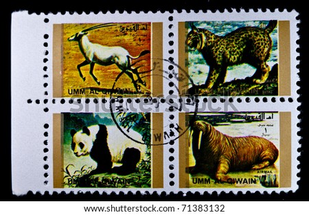 THE UNITED ARAB EMIRATES - CIRCA 1993: A Stamp printed in the UMM AL Qiwain shows various animals, circa 1993.