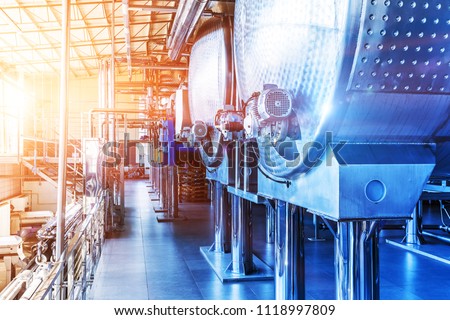 Interior of chemical factory or plant workshop with metal industrial manufacturing production equipment